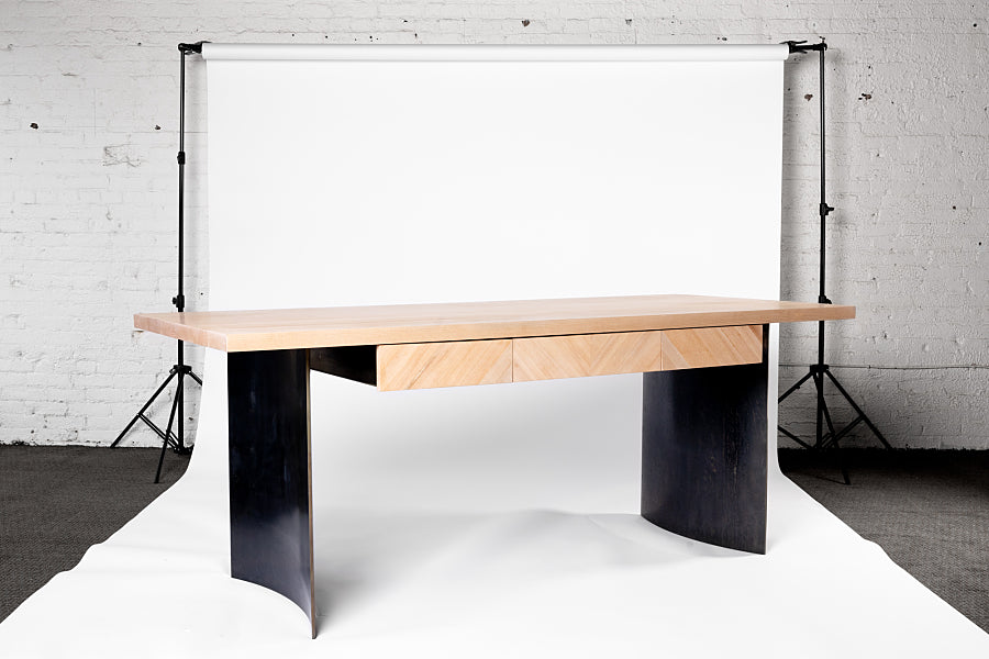 Ban wood and curved steel desk