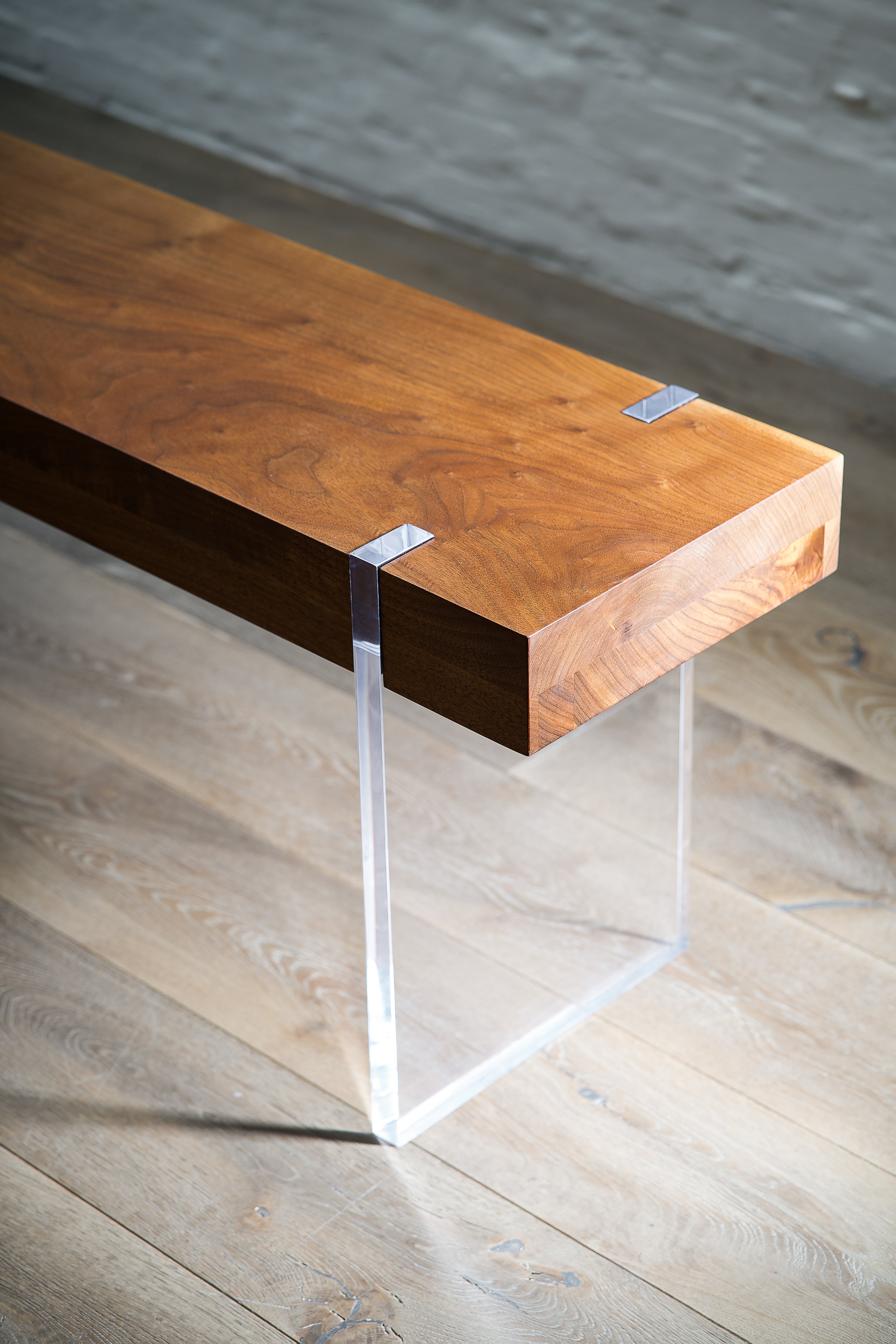 Solid wood bench—sculptural form with optional acrylic or steel accents, sustainable design from BC