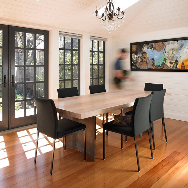 Eclectic Dining Room View of Modern Ban Dining Table with Nick Bantock Art - View of Whitened Wood and Curved Steel Legs