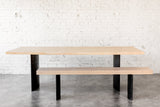 Industrial Ban Dining Table paired with Ban Dining Bench in Whitened Alder and Curved Raw Steel Legs