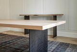 Closeup View of Ban Dining Table and Console - Both Featuring Curved Steel Legs and Whitened Wood Tabletops