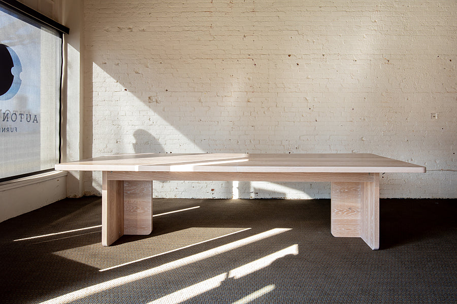 White Oak Extendable Dining Table leaf removed in showroom