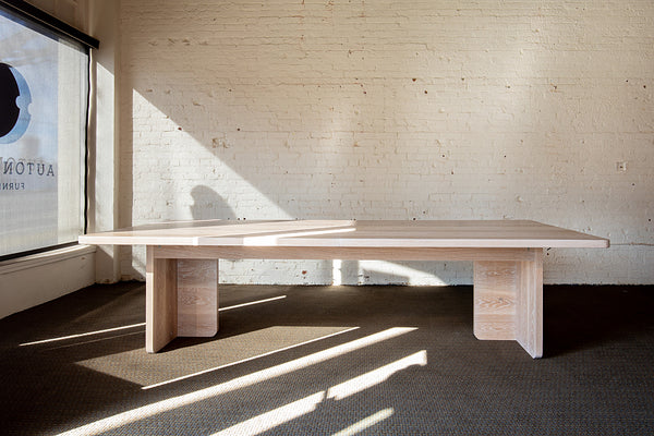 White Oak Extendable Dining Table leaf removed in showroom